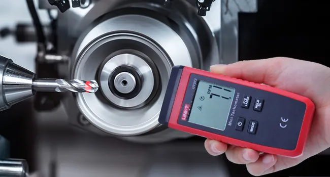 handheld non contact laser tachometer measuring motor rpm
